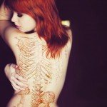 Bold and Cheeky Spine Tattoo Designs